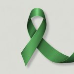 Green ribbon lapel for awareness of major depressive disorder or depression.